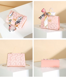 Detailed views of pink lace floral handbag with printed silk scarf and gold chain strap