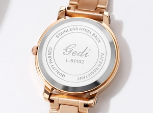 Detailed macro view of the rose gold stainless steel watch back with Gedi logo