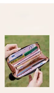 Internal view of long zipper wallet with pink multi-slot compartments and card holders