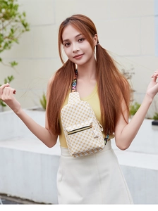 Detail of white chest bag with yellow pattern and colorful LOVE letter shoulder strap