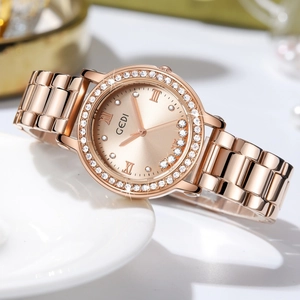 Rose gold luxury women's quartz watch with rhinestone bezel and sunburst dial detail