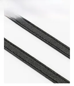 Close-up of black quilted shoulder bag strap with durable double stitching detail