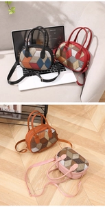 Detail view of plaid patterned handbags in black red brown and pink with adjustable straps