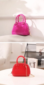Detail of mini PVC jelly shell bags with bead texture and gold chain straps