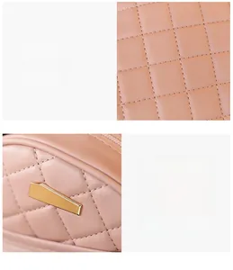 Macro shot of quilted pink PU leather fabric and polished gold metal hardware detail