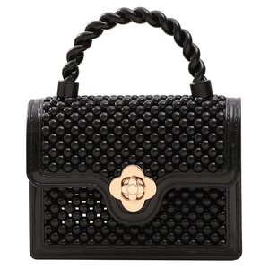 Mini sac gelée en PVC noir avec texture perlée et fermoir fleur dorée élégant