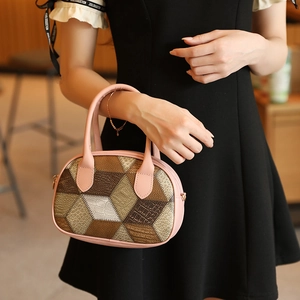 Pink and brown geometric patchwork handbag with shell shape and double handles