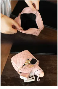 Detail view of pink quilted crossbody bag showing spacious interior for daily essentials