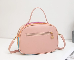 Pink PU leather crossbody bag featuring back zipper pocket and colorful woven texture detail