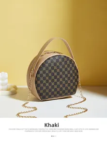 Detail of khaki round bag showing vintage geometric patterns and gold chain strap