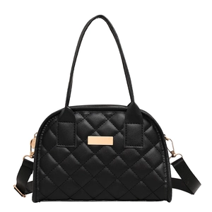 Fashionable black quilted handbag with gold metal detail and adjustable shoulder strap