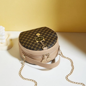 Chic beige crossbody bag with floral geometric pattern and cat-shaped metal charm