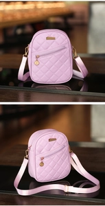 Detail of lavender quilted PU leather mini bag with gold hardware and dual zipper pockets