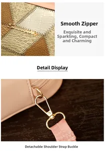 Close-up of smooth metal zipper and detachable strap buckle on croc-patterned bag