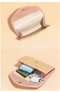 Detail of woven straw shoulder bag with pink faux leather lining and magnetic closure
