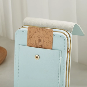 Vertical light blue lychee pattern shoulder bag with dual zippers and magnetic buckle