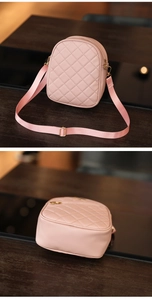 Detail view of pink quilted mini crossbody bag with diamond stitch and adjustable strap