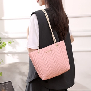 Pink quilted chevron tote bag with cream rope straps and gold Suvagey logo detail