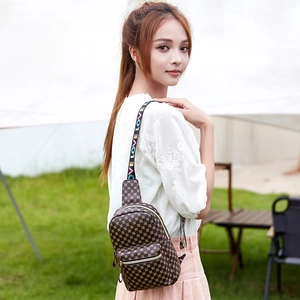 Brown printed women's chest bag with golden geometric pattern and 'LOVE' strap