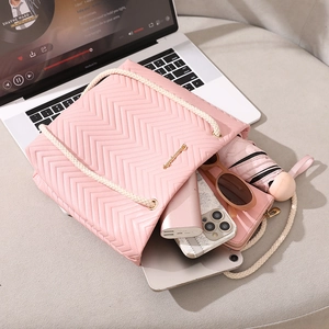 Pink quilted tote bag with rope handles and large capacity storage for daily essentials