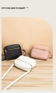 Close-up of quilted leather crossbody camera bags in black, pink and white with gold zippers
