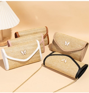 Detailed woven texture and butterfly clasp on bohemian straw envelope crossbody bags