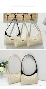 Detail of woven straw shoulder bag featuring decorative metal plate and faux leather trim