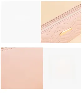 Detail of pink embroidered handbag featuring V-shaped quilting and golden metal fastener