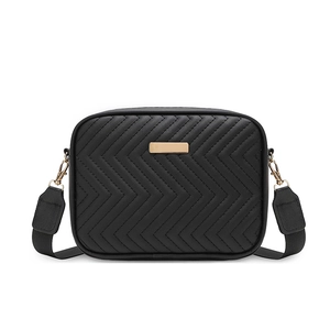 Chic black quilted camera bag with V-shaped stitching and gold hardware on white backdrop