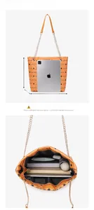 Detailed size guide and spacious interior of the orange quilted tote bag with gold chain