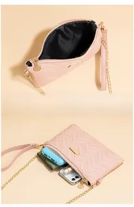 Pink quilted crossbody bag interior view showing space for phone and makeup items