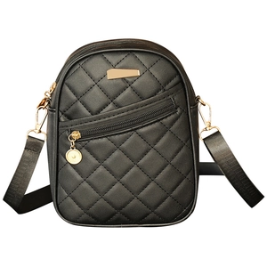 Black quilted crossbody bag with gold hardware and adjustable nylon shoulder strap
