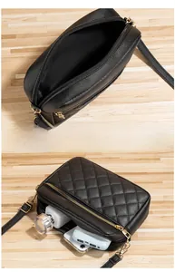 Detail view of double-zipper quilted crossbody bag showing spacious interior compartments