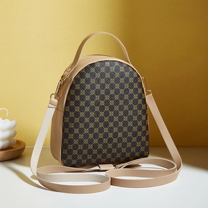 Retro mini leather backpack with geometric patterns and golden metal hardware detail