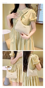 Detailed views of a beige straw shoulder bag with herringbone weave and metal plate