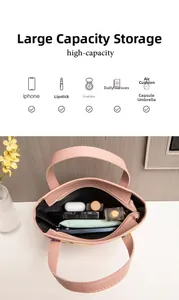 Borsa tote in pelle rosa con vista interna che mostra spazio per telefono e ombrello