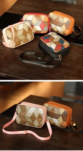 Detail of multi-texture leather patchwork and gold logo on crossbody camera bags