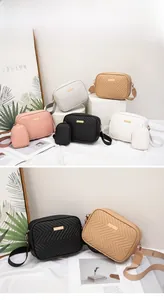 Detail of chevron quilted camera bags in multiple colors with matching round coin purses