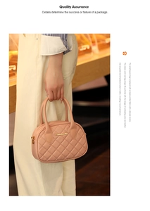 Detail of quilted leather handbag featuring elegant round handles and golden hardware