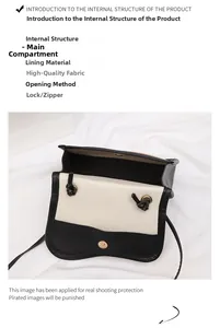 Detail view of the black and white straw bag showing interior main pocket and magnetic closure