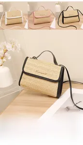 Straw crossbody bag details showing premium leather trim and golden metal logo hardware