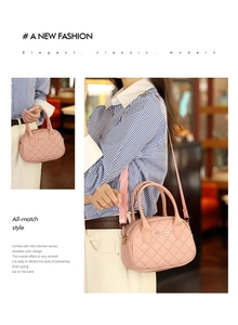 Detail of pink quilted handbag with wide woven strap and golden logo hardware