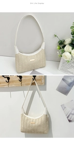 Detail view of woven straw shoulder bag with white leather trim and gold metal plate