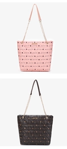 Detail of pink and dark brown printed tote bags with Luck For You metal logo and chain straps