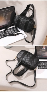 Close-up of black quilted Boston bag featuring diamond stitching and gold hardware accents