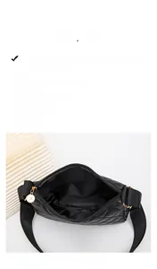 Detail view of the black quilted shoulder bag interior with high-quality lining and zip pocket