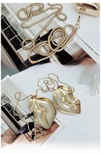 Macro detail of gold-plated lip-shaped clutch showing magnetic closure and snake chain