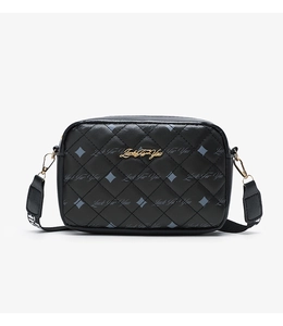 Close-up of black quilted camera bag with Luck For You print and golden metal logo