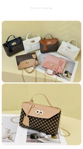 Detail of elegant patterned crossbody bags with metal twist locks and chain straps