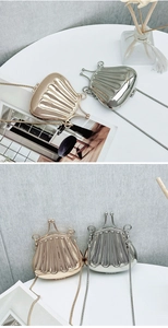 Shell-shaped evening bags in gold and silver finish with metal snake chain straps